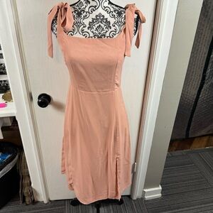 NWL baby pink tie shoulder strap stretch mini dress.  Size L